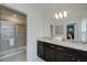 Double vanity bathroom with granite countertop and shower at 4063 Lana Ave, Davenport, FL 33897