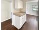 White kitchen cabinets and granite countertops at 613 Alpine St, Altamonte Springs, FL 32701
