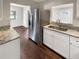 Updated kitchen featuring stainless steel appliances and granite countertops at 613 Alpine St, Altamonte Springs, FL 32701