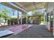 Covered patio with outdoor kitchen, pergola, and ample space for entertaining at 2881 St George Dr, Davenport, FL 33837
