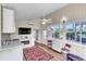 Open living space with kitchenette, TV, and access to patio at 2881 St George Dr, Davenport, FL 33837