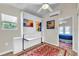 Bedroom with a Murphy bed, built-in shelves, and artwork at 2881 St George Dr, Davenport, FL 33837