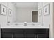 Modern bathroom with double vanity and dark cabinets at 1158 Drop Ln, Davenport, FL 33896