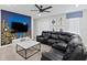 Game room with sectional sofa and large TV at 1158 Drop Ln, Davenport, FL 33896