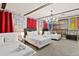 Three beds in a bedroom with stone wall and red curtains at 1158 Drop Ln, Davenport, FL 33896