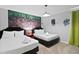 ' bedroom with twin beds, Minecraft mural, and playful decor at 1158 Drop Ln, Davenport, FL 33896