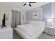 Main bedroom with king-size bed, TV, and ceiling fan at 1158 Drop Ln, Davenport, FL 33896
