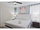 King-size bed in a bedroom with abstract art at 1158 Drop Ln, Davenport, FL 33896