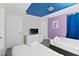 Bright bedroom with two twin beds, dresser, and TV at 1158 Drop Ln, Davenport, FL 33896