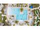 Aerial view of a large resort-style pool with plenty of surrounding lounge chairs at 1158 Drop Ln, Davenport, FL 33896