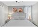 King bedroom with white furniture and ceiling fan at 1158 Drop Ln, Davenport, FL 33896
