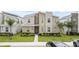 Modern two-story home with stone and light-colored siding at 1158 Drop Ln, Davenport, FL 33896