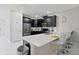 Modern kitchen with island and stainless steel appliances at 1158 Drop Ln, Davenport, FL 33896