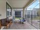 Covered patio with seating area and view of the pool at 1158 Drop Ln, Davenport, FL 33896