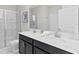 Bathroom with double vanity and walk-in shower at 1158 Drop Ln, Davenport, FL 33896