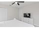 King-size bed in a bedroom with dresser and TV at 1158 Drop Ln, Davenport, FL 33896