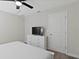 Bedroom with king bed, dresser, and TV at 1158 Drop Ln, Davenport, FL 33896