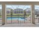 Private screened pool and spa with patio furniture at 1158 Drop Ln, Davenport, FL 33896