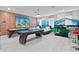 Fun game room with pool table, air hockey, and bunk beds at 1158 Drop Ln, Davenport, FL 33896