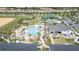 Aerial view of community amenities including pool, clubhouse, and mini golf at 1158 Drop Ln, Davenport, FL 33896