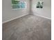 Bright bedroom featuring neutral carpeting and ample natural light at 260 Pineview Dr, Oviedo, FL 32765