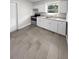 Modern kitchen with white cabinetry and stylish tile flooring at 260 Pineview Dr, Oviedo, FL 32765