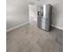 Kitchen features stainless steel refrigerator and tile floors at 260 Pineview Dr, Oviedo, FL 32765