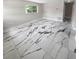 Living room showcasing elegant marble-look tile flooring at 260 Pineview Dr, Oviedo, FL 32765