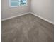 Simple bedroom with neutral carpeting and natural light at 260 Pineview Dr, Oviedo, FL 32765
