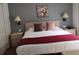 Main bedroom with king-size bed and nightstands at 1107 Park Ridge Cir, Kissimmee, FL 34746