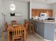 Kitchen with breakfast bar and dining table at 1107 Park Ridge Cir, Kissimmee, FL 34746