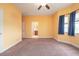 Primary bedroom with access to bathroom and neutral decor at 17335 Chateau Pine Way, Clermont, FL 34711