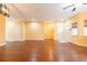 Large living room with hardwood floors and neutral walls at 17335 Chateau Pine Way, Clermont, FL 34711