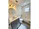 Modern bathroom with a bathtub, toilet and vanity at 5326 Moxie Blvd, Orlando, FL 32839