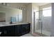 Modern bathroom with double vanity and shower at 4832 Tribute Trl, Kissimmee, FL 34746