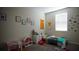 Youth bedroom with playful decor and ample closet space at 4832 Tribute Trl, Kissimmee, FL 34746