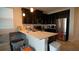Modern kitchen with dark cabinets, stainless steel appliances, and an island at 4832 Tribute Trl, Kissimmee, FL 34746
