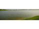 Calm lake view with houses in the background at 4832 Tribute Trl, Kissimmee, FL 34746