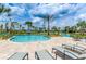 Resort-style pool with a lazy river and lounge chairs at 4832 Tribute Trl, Kissimmee, FL 34746
