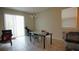 Small dining area with glass top table and chairs at 4832 Tribute Trl, Kissimmee, FL 34746