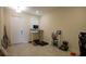 Entryway with tiled floors and a home office setup at 4832 Tribute Trl, Kissimmee, FL 34746