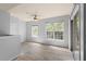 Bright bedroom with wood-look tile floors, neutral walls and access to a balcony at 4368 S Kirkman Rd # 212, Orlando, FL 32811