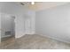 Bedroom with door to bathroom and ceiling fan at 4368 S Kirkman Rd # 212, Orlando, FL 32811