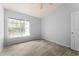 Bedroom with ceiling fan and large window at 4368 S Kirkman Rd # 212, Orlando, FL 32811