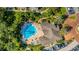 Arial view of community pool with spa and lounge area, surrounded by lush landscaping at 4368 S Kirkman Rd # 212, Orlando, FL 32811