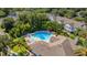 Aerial view showing a community pool with surrounding patio and landscaping at 4368 S Kirkman Rd # 212, Orlando, FL 32811