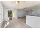 Dining area with wood-look tile flooring, access to balcony, and open to living room at 4368 S Kirkman Rd # 212, Orlando, FL 32811