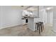 Kitchen with white cabinets, stove, and breakfast bar at 4368 S Kirkman Rd # 212, Orlando, FL 32811