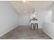 Galley kitchen with white cabinets, microwave, and breakfast bar at 4368 S Kirkman Rd # 212, Orlando, FL 32811