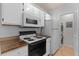 Updated kitchen with modern appliances and granite counters at 4368 S Kirkman Rd # 212, Orlando, FL 32811